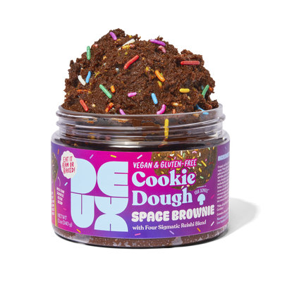 Jar of Space Brownie cookie dough overflowing with colorful sprinkles on top of the cookie dough..